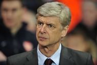 Arsenal manager Arsene Wenger takes his seat in north London on February 19, 2013